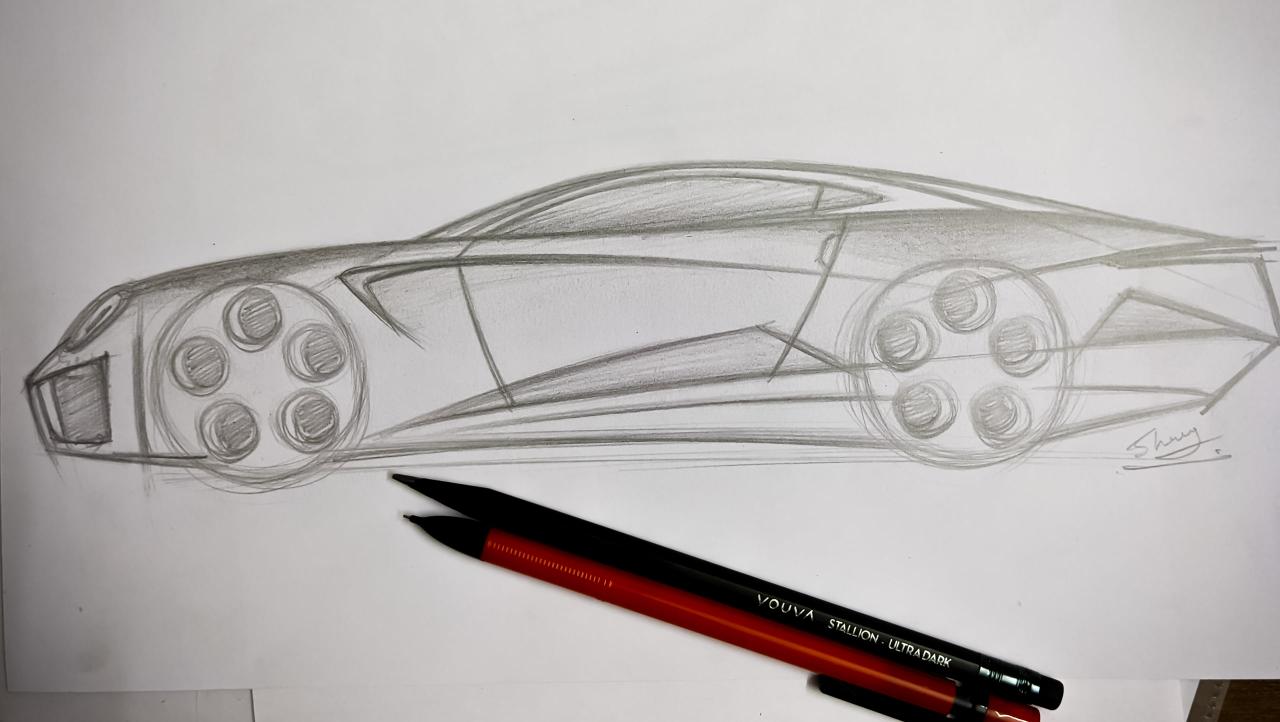 A side-profile pencil study of a mid-engined coupe filling a landscape sheet: two wheels drawn as circles with a six-hole rim pattern, a long cabin set well back, a ground line under the car, and a signature at the rear. Two pencils lie across the bottom of the sheet.
